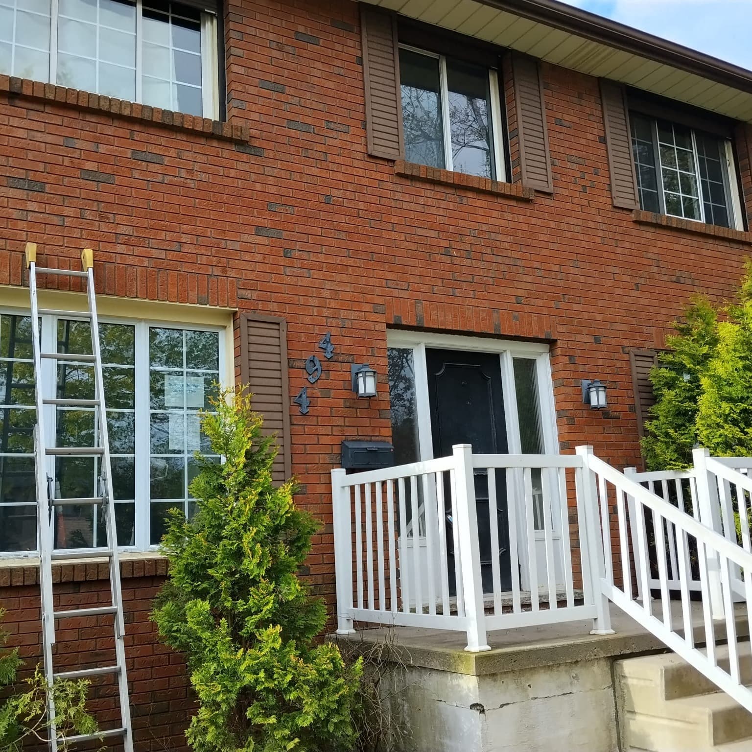 Professional pressure washing service on a residential home